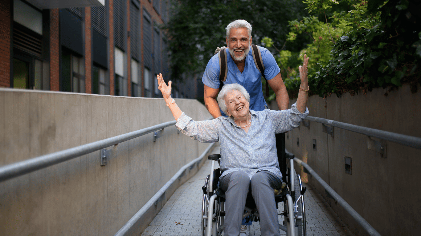 A caregiver transporting a senior with dementia.